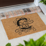 clay/monogram doormat