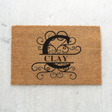 clay/monogram doormat